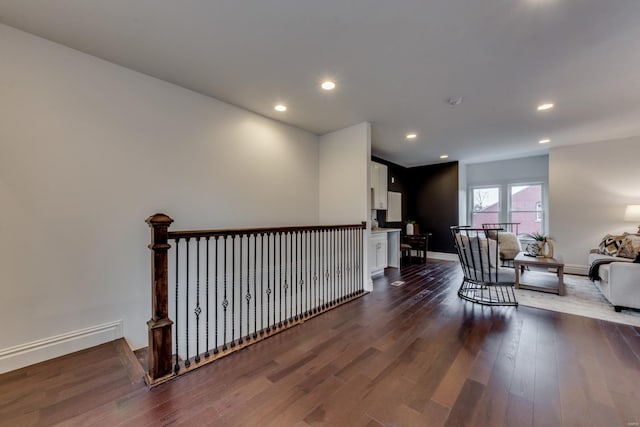 1029 Lami, Saint Louis, MO 63104 - corridor featuring dark wood-style flooring, baseboards, recessed lighting, and an upstairs landing