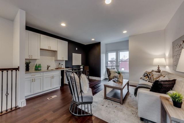 1029 Lami, Saint Louis, MO 63104 - living area featuring dark wood-style flooring, recessed lighting, and baseboards