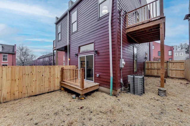 1029 Lami, Saint Louis, MO 63104 - view of property exterior with central air condition unit, a fenced backyard, and a deck