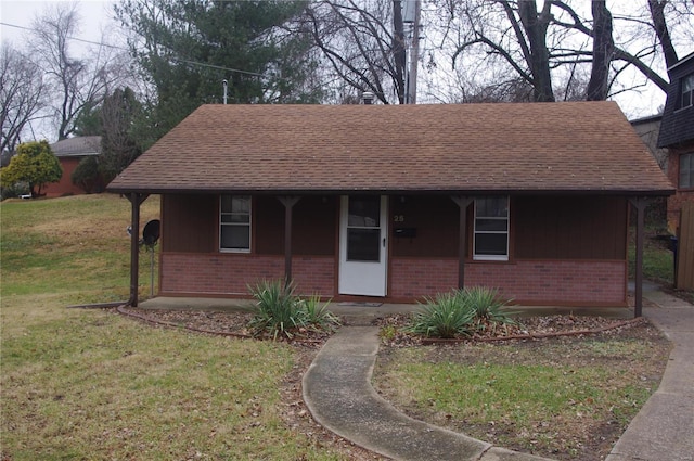 25 N 44th St, Belleville, IL 62226 - ranch-style house with brick siding, roof with shingles, and a front lawn