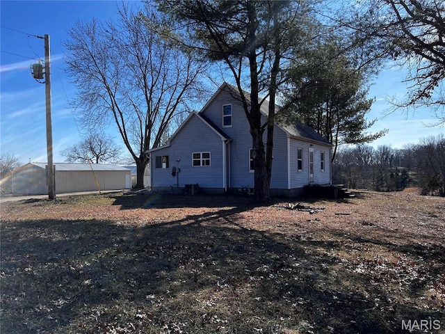 901 Edgemont Blvd, Perryville, MO 63775 - view of home's exterior featuring cooling unit and an outbuilding