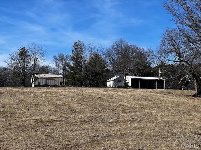 901 Edgemont Blvd, Perryville, MO 63775 - view of yard featuring a carport, an outbuilding, and an outdoor structure