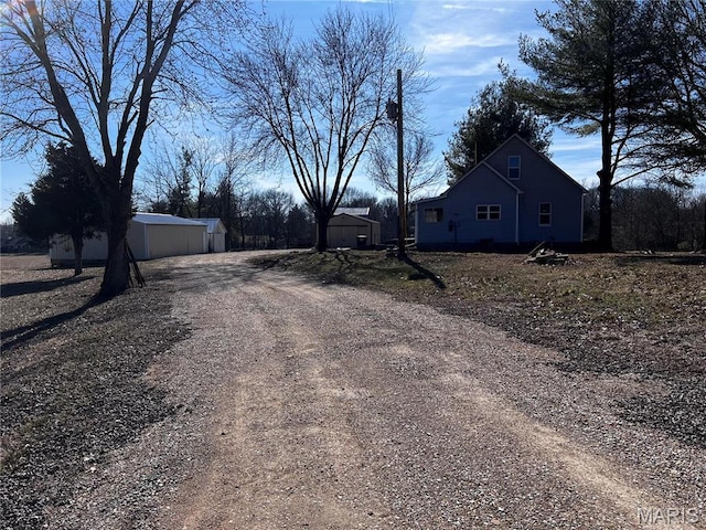 901 Edgemont Blvd, Perryville, MO 63775 - view of dirt / gravel driveway featuring an outbuilding