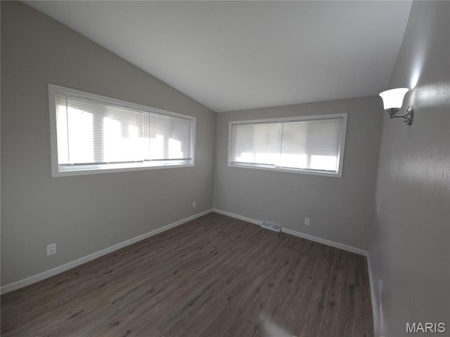 10468 Halls Ferry Rd, Saint Louis, MO 63136 - empty room with lofted ceiling, wood finished floors, and baseboards