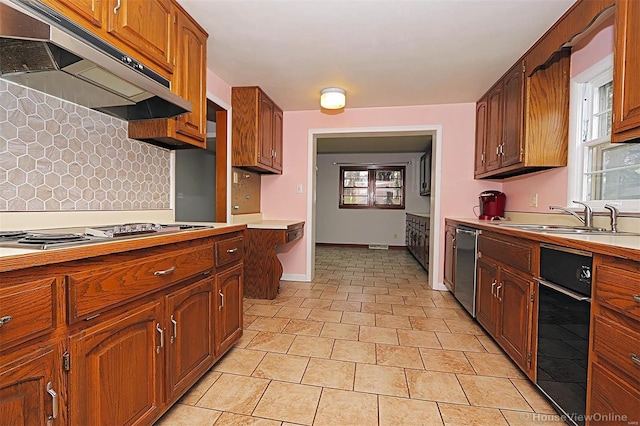 820 Sharon Dr, Cape Girardeau, MO 63701 - kitchen featuring under cabinet range hood, stovetop, a sink, decorative backsplash, and dishwasher