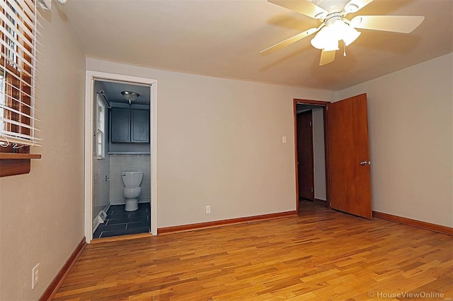 820 Sharon Dr, Cape Girardeau, MO 63701 - empty room with light wood-style floors, ceiling fan, and baseboards