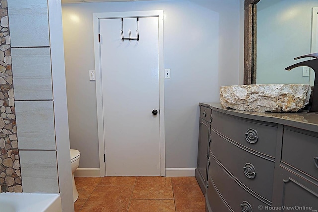 820 Sharon Dr, Cape Girardeau, MO 63701 - bathroom with baseboards, vanity, and toilet