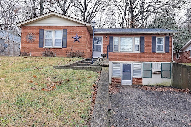 820 Sharon Dr, Cape Girardeau, MO 63701 - view of front of house with a front lawn, brick siding, and a vegetable garden