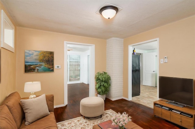 601 E Jefferson St, Ofallon, IL 62269 - living room with dark wood finished floors and baseboards