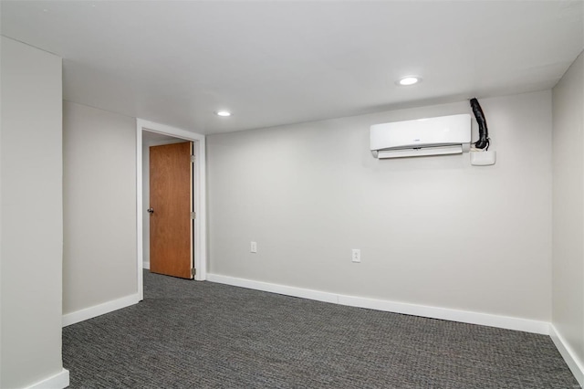601 E Jefferson St, Ofallon, IL 62269 - below grade area with a wall unit AC, dark carpet, baseboards, and recessed lighting