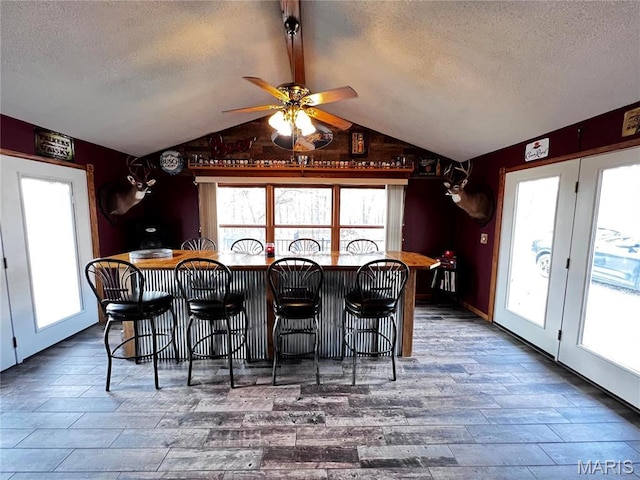 1034 Port Perry Dr, Perryville, MO 63775 - dining space featuring a textured ceiling, ceiling fan, and wood finished floors
