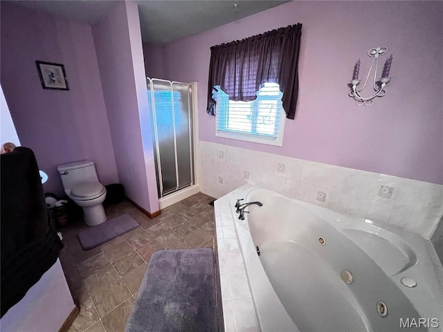 1034 Port Perry Dr, Perryville, MO 63775 - full bathroom featuring toilet, a stall shower, tile patterned floors, a jetted tub, and baseboards