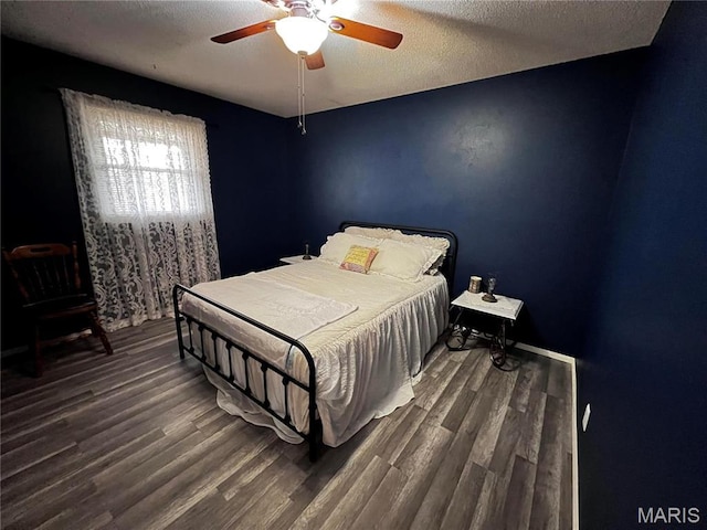 1034 Port Perry Dr, Perryville, MO 63775 - bedroom with wood finished floors, ceiling fan, and a textured ceiling