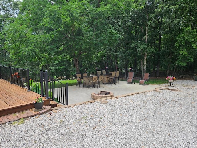 1034 Port Perry Dr, Perryville, MO 63775 - view of yard featuring a fire pit, a patio, a deck, and outdoor dining area