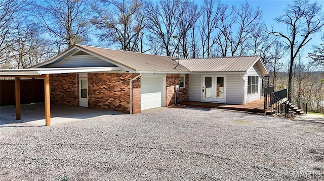 1034 Port Perry Dr, Perryville, MO 63775 - ranch-style house featuring an attached garage, driveway, metal roof, a carport, and a deck