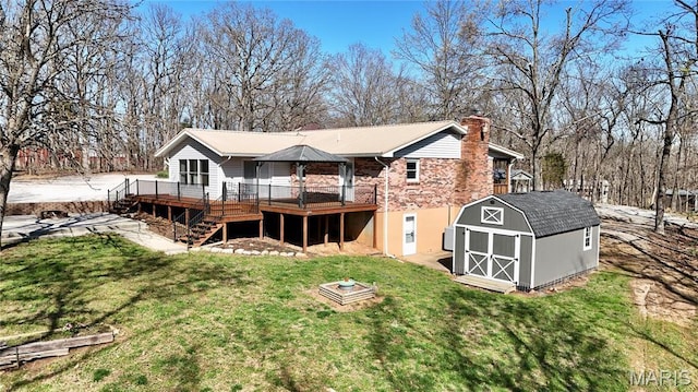 1034 Port Perry Dr, Perryville, MO 63775 - back of property with a storage shed, a wooden deck, a chimney, an outbuilding, and stairway
