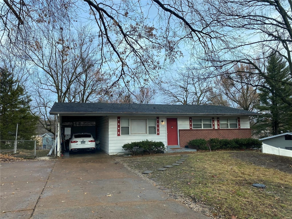 1765 Cargill Dr, Saint Louis, MO 63136 - single story home with driveway, brick siding, and an attached carport