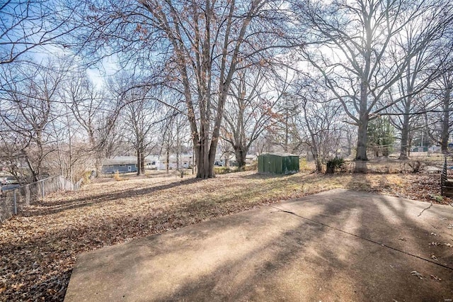 10144 Dellridge Ln, Saint Louis, MO 63136 - view of yard featuring a patio, fence, an outdoor structure, and a shed
