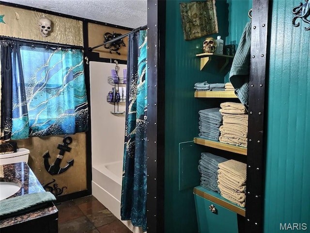 813 Kendall Dr, Poplar Bluff, MO 63901 - bathroom with shower / tub combo with curtain, vanity, and a textured ceiling