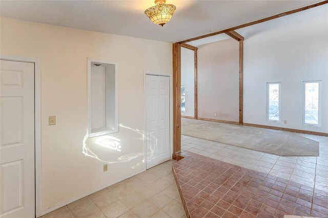 6866 Frandsen Rd, Alhambra, IL 62001 - unfurnished room featuring light tile patterned floors and baseboards