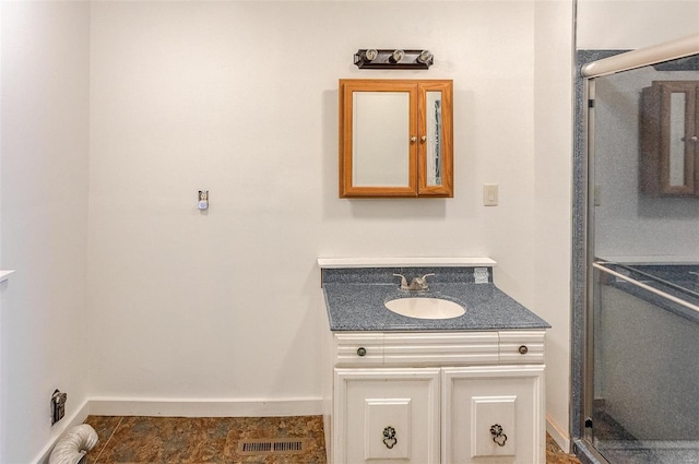 6866 Frandsen Rd, Alhambra, IL 62001 - full bathroom featuring vanity, a stall shower, and baseboards