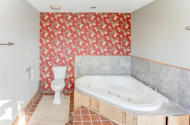 6866 Frandsen Rd, Alhambra, IL 62001 - full bath featuring wallpapered walls, toilet, a whirlpool tub, tile patterned flooring, and baseboards