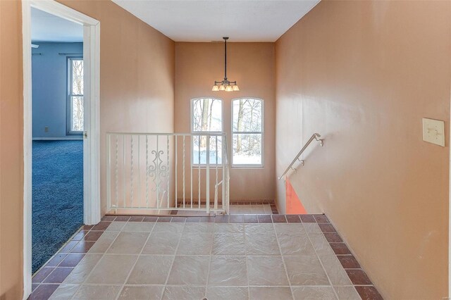 6866 Frandsen Rd, Alhambra, IL 62001 - carpeted entrance foyer with a chandelier