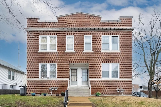 4201 Walsh St, Saint Louis, MO 63116 - view of front of home with brick siding, a chimney, and fence