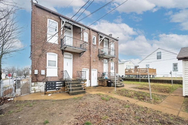 4201 Walsh St, Saint Louis, MO 63116 - rear view of house featuring brick siding, fence, and a gate