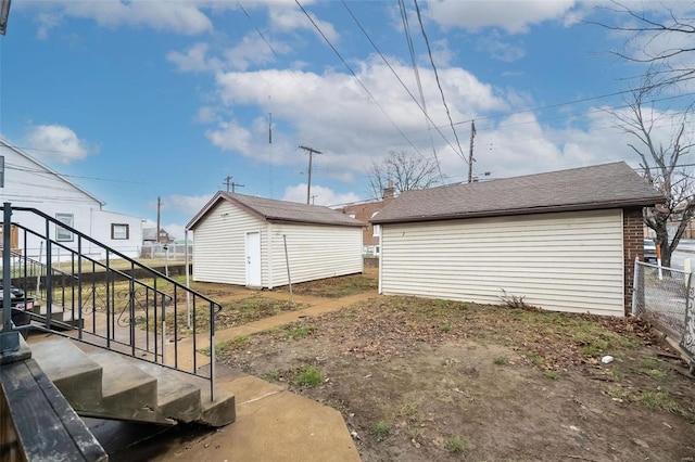 4201 Walsh St, Saint Louis, MO 63116 - view of yard featuring an outbuilding, stairs, and fence