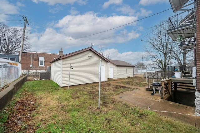 4201 Walsh St, Saint Louis, MO 63116 - view of side of property featuring an outbuilding and a patio area