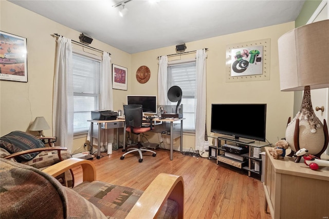 10319 Cable Ave, Frontenac, MO 63131 - home office featuring light wood finished floors and rail lighting