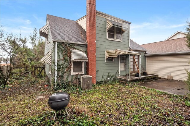 10319 Cable Ave, Frontenac, MO 63131 - rear view of property with central AC, fence, a chimney, a patio, and roof with shingles