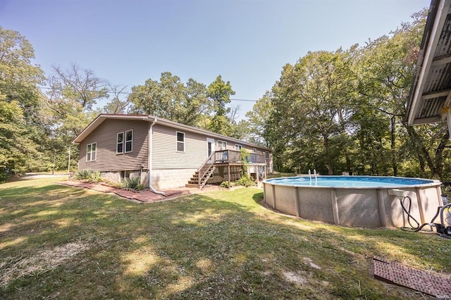 364 N 7th Ln, Fillmore, IL 62032 - view of grassy yard featuring stairs, a wooden deck, an outdoor pool, and view of scattered trees