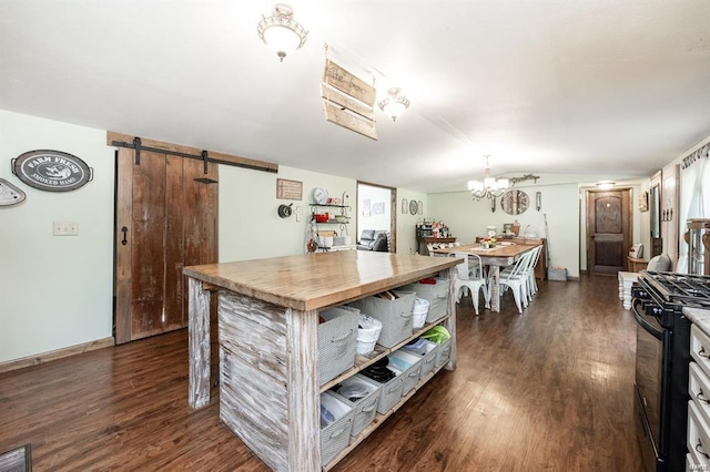 364 N 7th Ln, Fillmore, IL 62032 - kitchen featuring gas stove, a barn door, dark wood-style flooring, a chandelier, and lofted ceiling