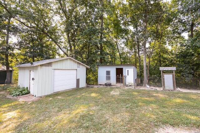 364 N 7th Ln, Fillmore, IL 62032 - view of front facade with a detached garage, an outbuilding, and view of scattered trees