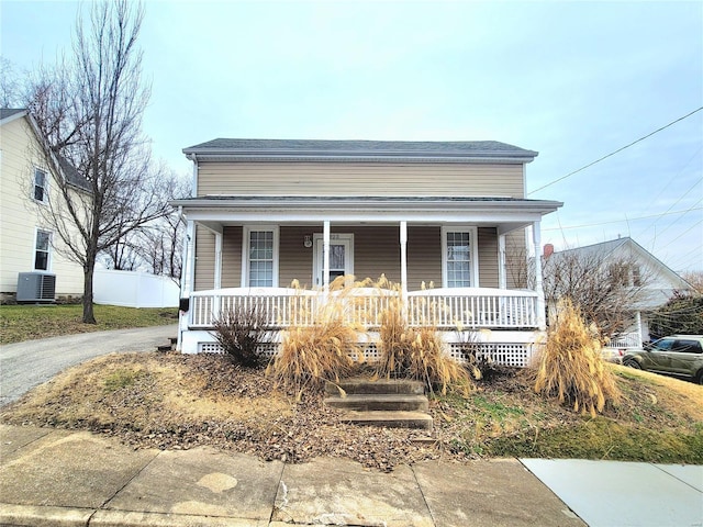 305 Macarthur St, Washington, MO 63090 - view of front of home with covered porch, central AC unit, and fence