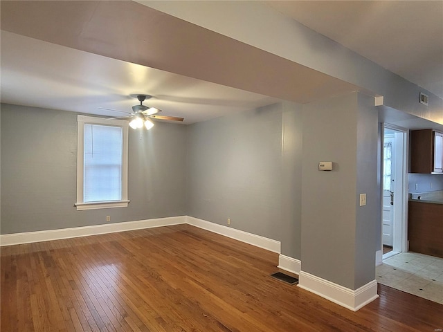 305 Macarthur St, Washington, MO 63090 - spare room featuring wood-type flooring, baseboards, and ceiling fan
