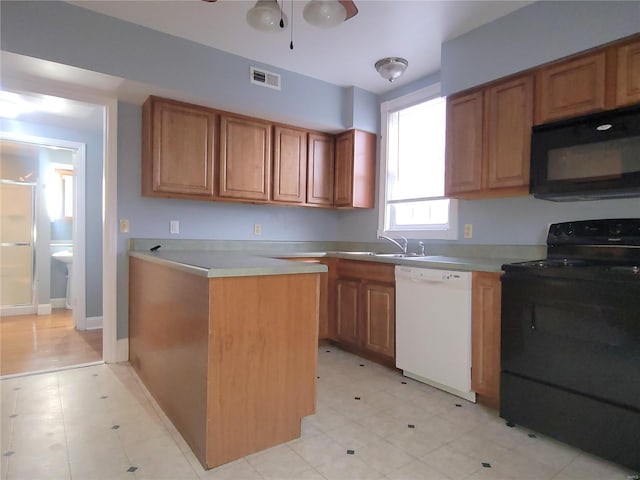 305 Macarthur St, Washington, MO 63090 - kitchen with black appliances, a sink, light countertops, brown cabinets, and ceiling fan