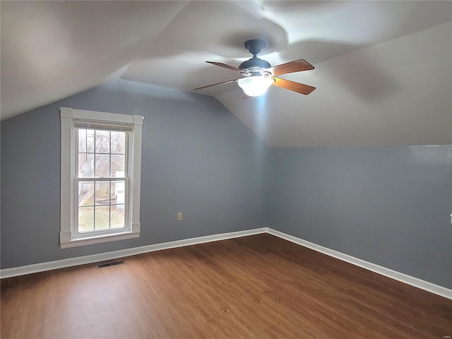 305 Macarthur St, Washington, MO 63090 - additional living space featuring dark wood-style flooring, ceiling fan, baseboards, and lofted ceiling