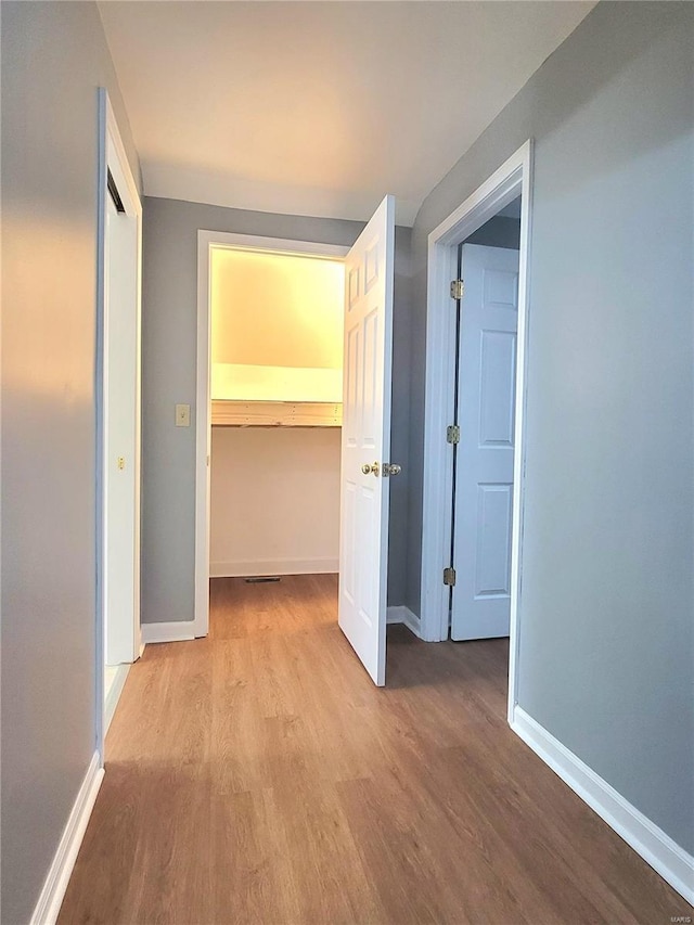 305 Macarthur St, Washington, MO 63090 - hallway featuring wood finished floors and baseboards