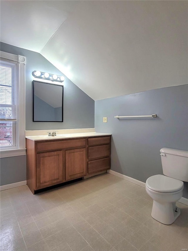 305 Macarthur St, Washington, MO 63090 - bathroom featuring vaulted ceiling, baseboards, toilet, and vanity
