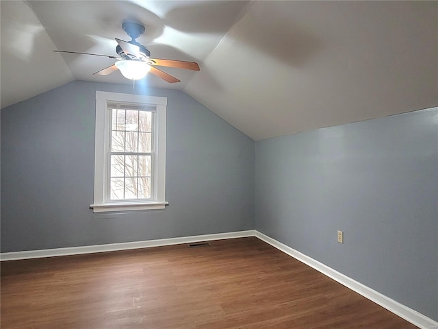 305 Macarthur St, Washington, MO 63090 - bonus room featuring a ceiling fan, dark wood-style flooring, vaulted ceiling, and baseboards