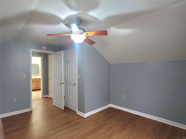 305 Macarthur St, Washington, MO 63090 - additional living space with vaulted ceiling, ceiling fan, dark wood-type flooring, and baseboards