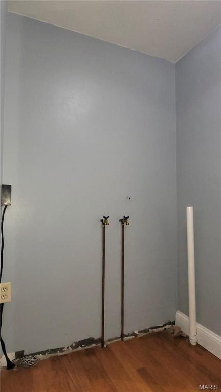 305 Macarthur St, Washington, MO 63090 - laundry room with wood finished floors and hookup for a washing machine