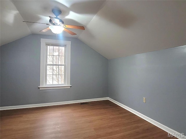 305 Macarthur St, Washington, MO 63090 - bonus room with dark wood finished floors, ceiling fan, and lofted ceiling