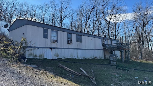 view of side of home featuring cooling unit