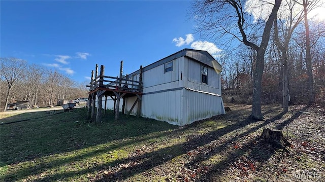 view of property exterior with a deck