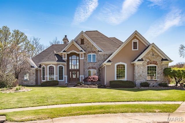 2314 Longest Dr, Wentzville, MO 63385 - french country style house featuring stone siding, stucco siding, a front lawn, and a chimney