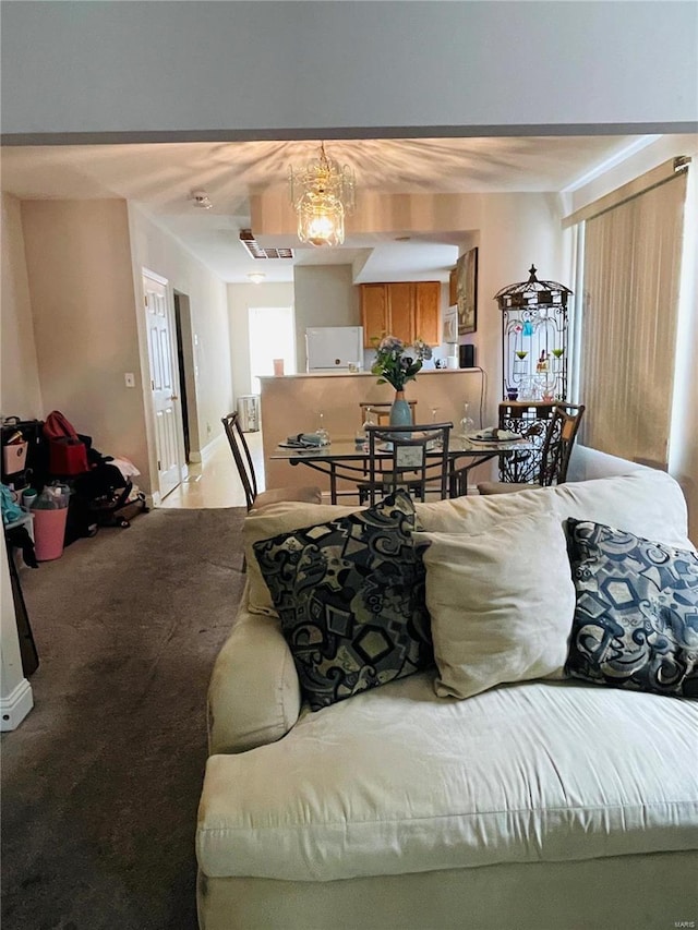 4934 W Florissant Ave, Saint Louis, MO 63115 - living room featuring light colored carpet and baseboards